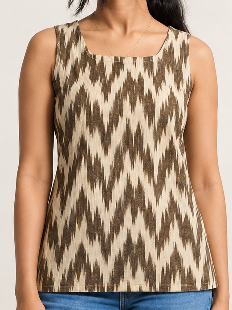 Earth Ikat Top — earth and ivory ikat sleeveless top worn with jeans, front view