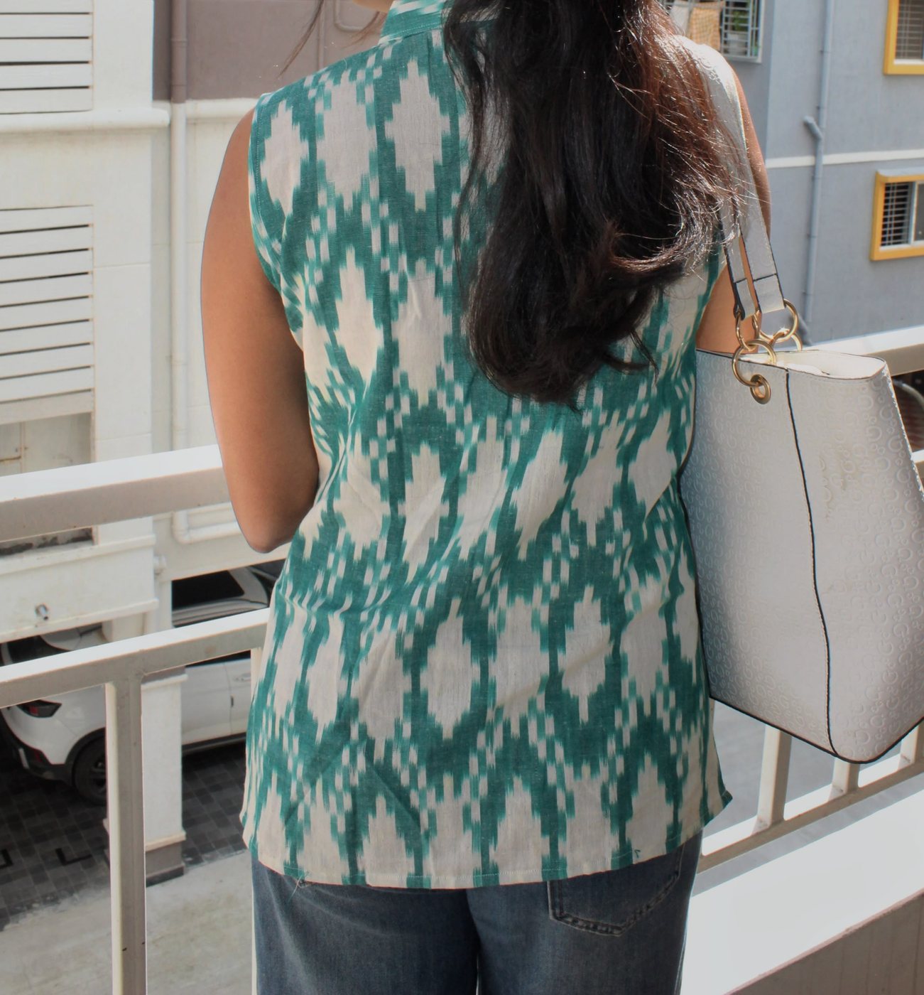 Vanya in Teal — side view showing the hip-length hem and side slit
